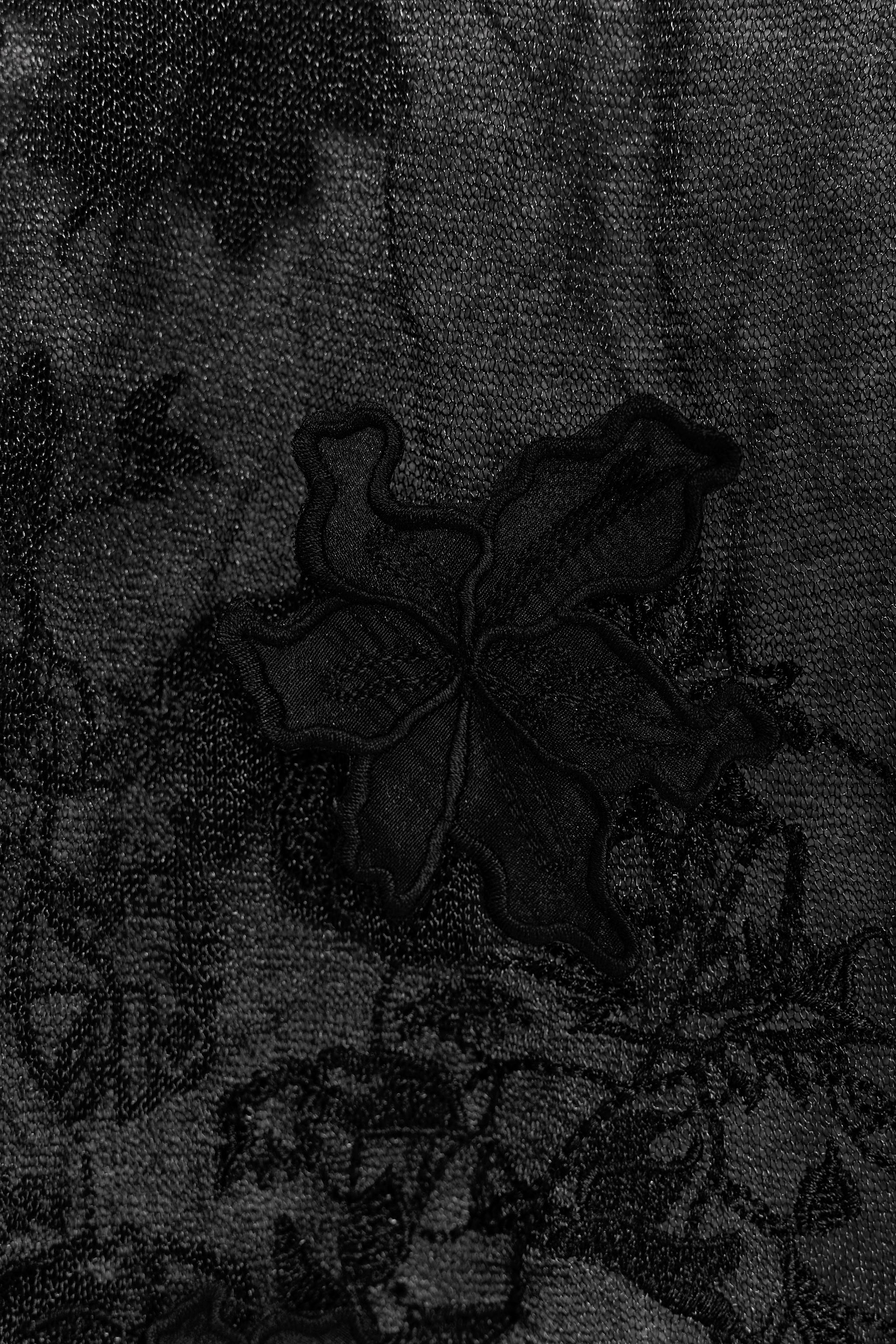 JUPE SEMI-TRANSPARENTE EN MAILLE STRUCTURÉE